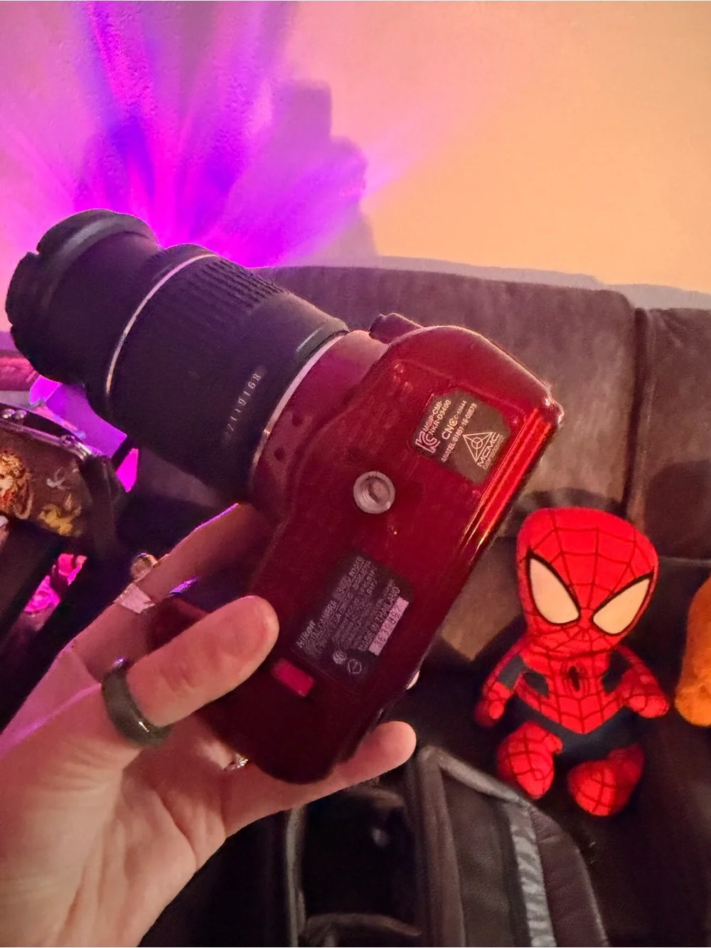 Nikon red DSLR with Nikon lens cap
